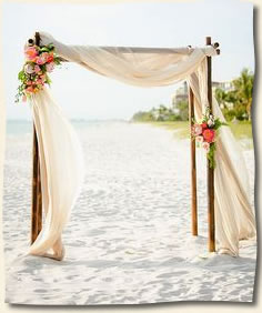 flowers on beach arch wedding