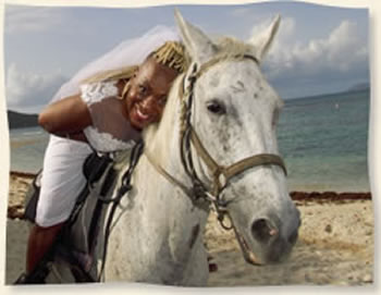 A bride and her white horse on her wedding day.