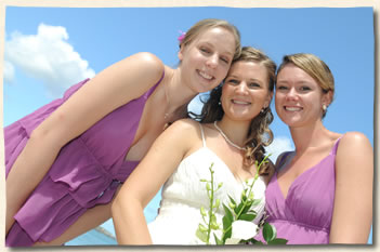 Just married bride with bridesmaids at Magens Beach