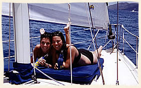 Married couple chilling under sail.  Virgin Islands