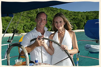 Couple at helm - married on sailboat - St. Thomas Virgin Islands