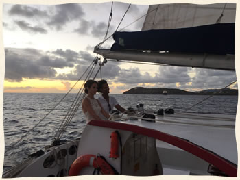 Bride at the helm of sailboat - US Virgin Islands