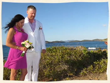 Couple praying at their island dream wedding at Pretty Klip Point St. Thomas.